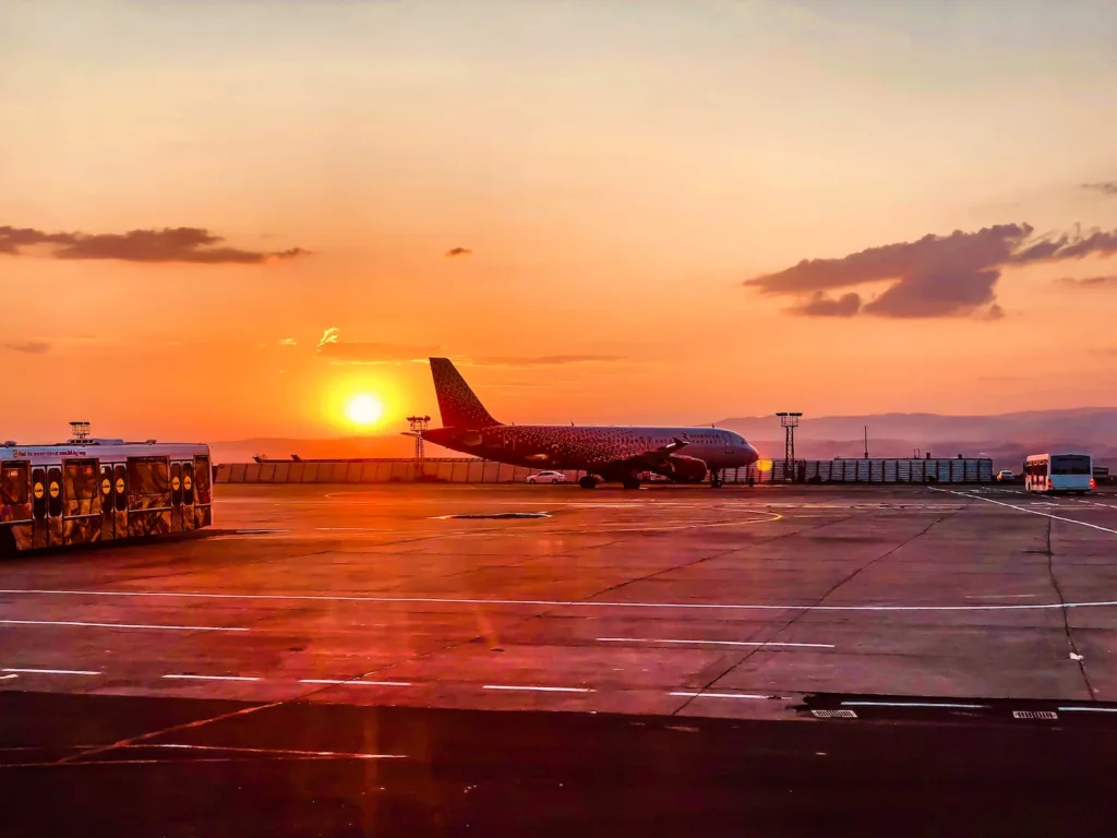 airplane on airport during sunset